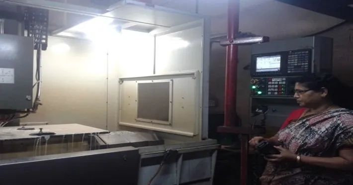 Smt. Meenakumari at the CNC machine